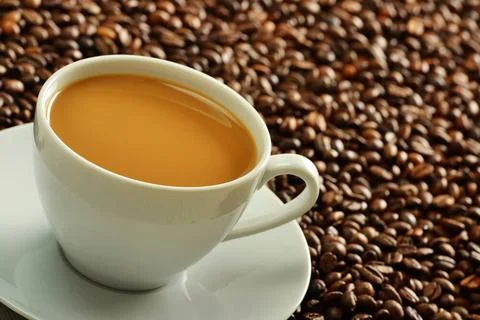 Composition with cup and coffee beans Composition with cup and coffee bean... Stock-Fotos