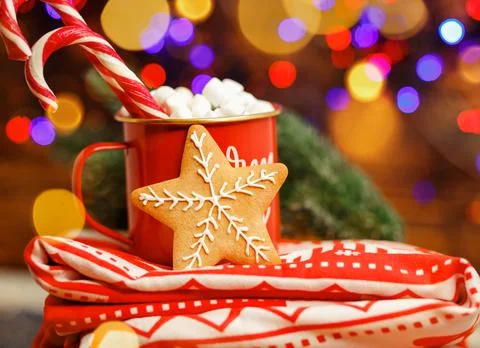 Composition with a cup and red blanket. Christmas hot drink Stock-Fotos