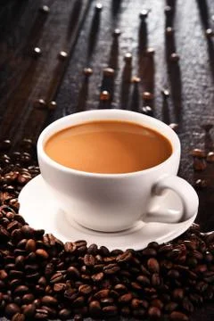 Composition with cup of coffee and beans. Stock Photos