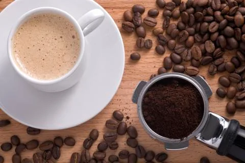 Composition with a cup of coffee and filter holder. Stock Photos