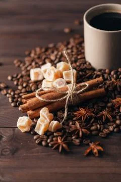 Composition  cup with coffee beans on black background Stock Photos