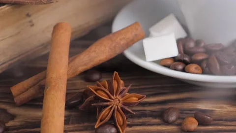 Composition of the cup of coffee with roasted beans of coffee on a wooden table. Stock Footage 130254872