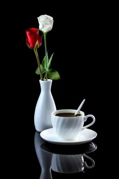 Composition with cup of coffee, white and red rose on a black reflective back Stock Photos