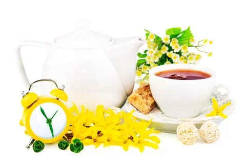 Composition from cup of tea, clock and spring flowers Stock Photos