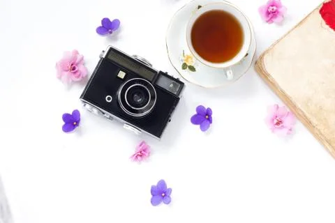 Composition with cup of tea, vintage camera, old books on white background To Stock Photos