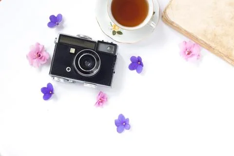 Composition with cup of tea, vintage camera, old books on white background To Stock Photos