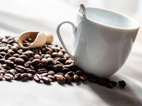 Composition of cups and coffee beans on a white background Stock Photos