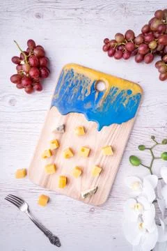 Composition cutting board with an abstract pattern, cheese, honey grapes, orc 写真素材
