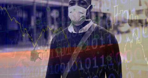 Composition of data processing and covid 19 cells over man wearing face mask in Foto stock