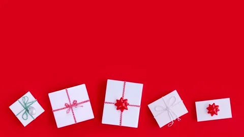 Composition decor christmas gifts on red background top view with place for text Stock Footage 217378554