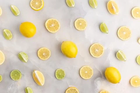 Composition of delicious citrus fruit and green leaves on grey background Stock Photos