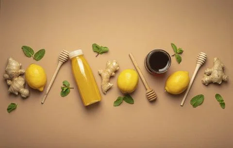 Composition with detox drink, lemons, mint, ginger, honey in glass jar, honey Stock Photos