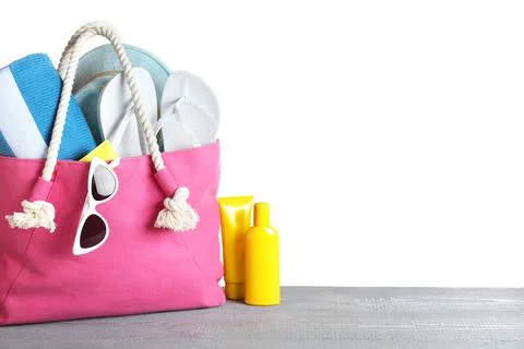 Composition with different beach objects on grey wooden table, white backgrou Stock Photos