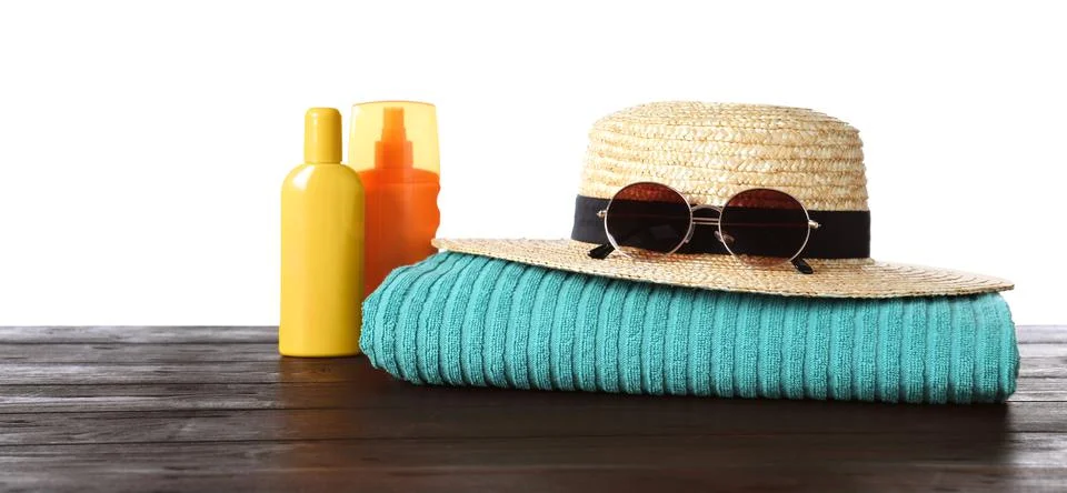 Composition with different beach objects on wooden table, white background Stock Photos