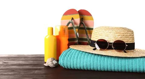 Composition with different beach objects on wooden table, white background Stock Photos
