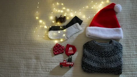 Composition with different Christmas accessories, sweater, Santa hat, socks, a Stock Footage 164541579