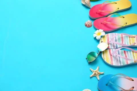 Composition with different flip flops and space for text on blue background,  스톡 사진