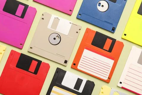 Composition with different floppy disks on green background 库存照片