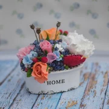 Composition of different flowers in a pot Stock Photos