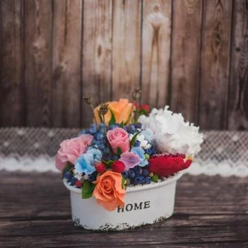 Composition of different flowers in a pot Stock Photos