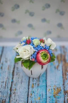 Composition of different flowers in a pot Stock Photos