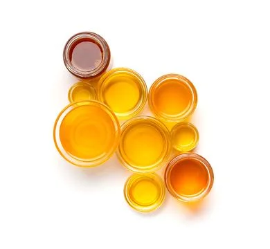 Composition from different jars with honey on isolation top view. Stock Photos
