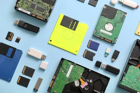 Composition with different memory storage devices on blue background 库存照片