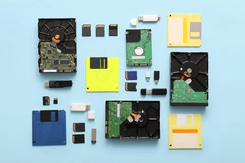 Composition with different memory storage devices on blue background 库存照片