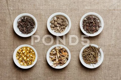 Composition of different natural dry tea leaves Stock Photos