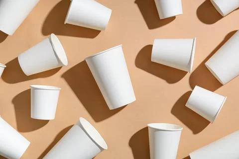 Composition with different paper cups on beige background Stock Photos