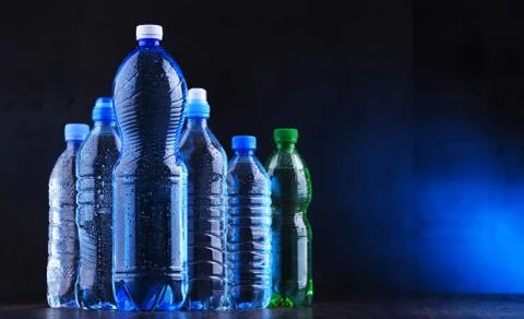 Composition with different sorts of bottles containing mineral water. Stock Photos