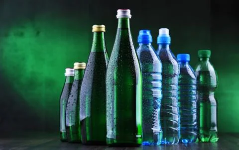 Composition with different sorts of bottles containing mineral water. Stock Photos
