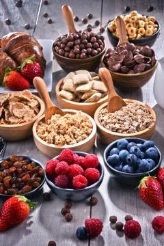 Composition with different sorts of breakfast cereal products and fresh fruit Stock Photos