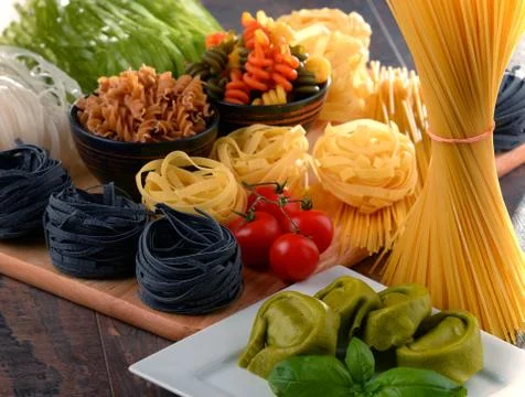 Composition with different sorts of pasta on kitchen table. Stock-Fotos