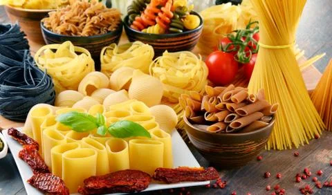 Composition with different sorts of pasta on kitchen table. Foto stock