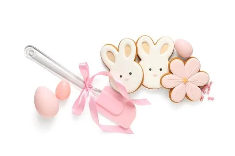 Composition with different tasty Easter cookies, eggs and spatula isolated on Stock Photos
