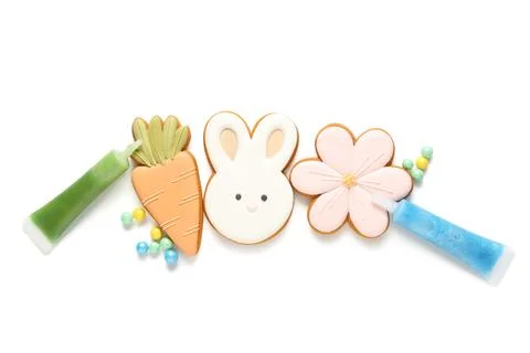 Composition with different tasty Easter cookies and sprinkles isolated on whi Stock Photos