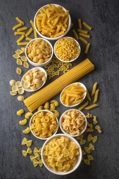 Composition with different tasty uncooked pasta - Italian pasta wallpaper, .. Stock Photos