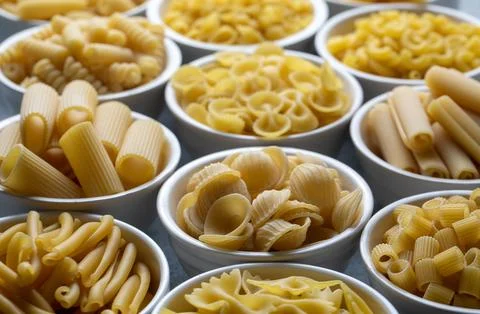 Composition with different tasty uncooked pasta - Italian pasta wallpaper, .. Stock Photos