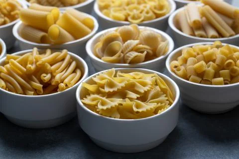 Composition with different tasty uncooked pasta - Italian pasta wallpaper, .. Stock Photos