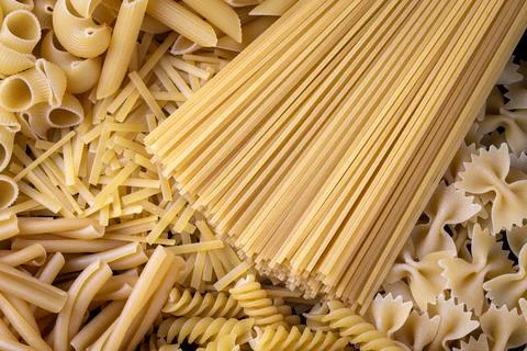 Composition with different tasty uncooked pasta - Italian pasta wallpaper, .. Stock Photos