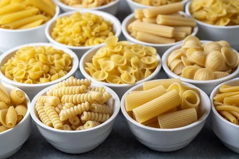 Composition with different tasty uncooked pasta - Italian pasta wallpaper, .. Stock Photos