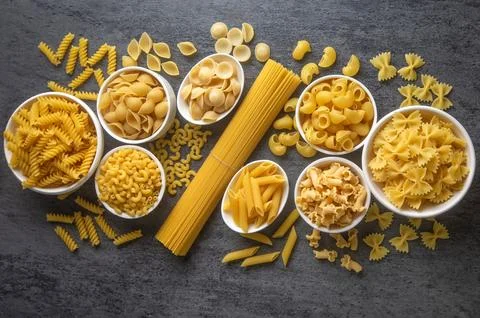 Composition with different tasty uncooked pasta - Italian pasta wallpaper, .. Stock Photos