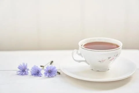 The composition of the drink from chicory, cups and saucers on a wooden table Stock Photos