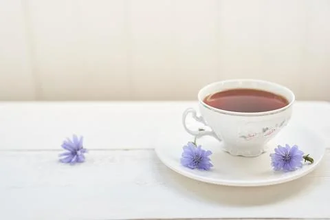 The composition of the drink from chicory, cups and saucers on a wooden table Stock Photos