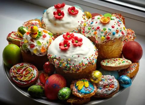 Composition of Easter Cakes decorated with white sugar glaze, sweet flowers a Stock Photos