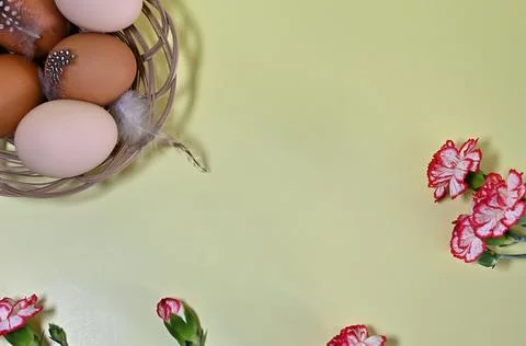 Composition with Easter eggs and branches on yellow background.Postcard. Stock Photos