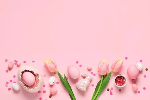 Composition with Easter eggs, confetti and tulip flowers on pink background Stock Photos