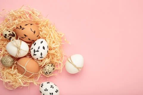Composition with Easter eggs on pink background Stock Photos
