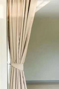 Composition of the elegant curtains against a wall Stock Photos